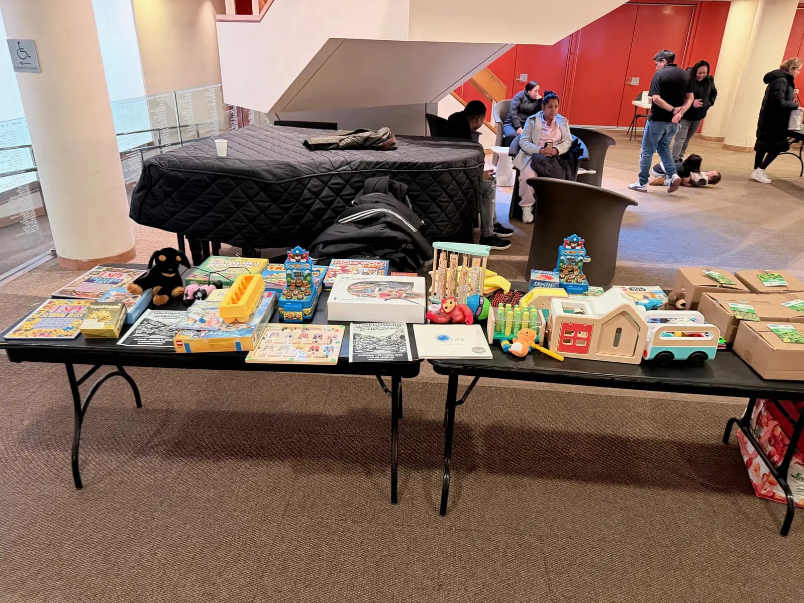 The tables laid out with MintBoxes, toys and games before the doors opened.